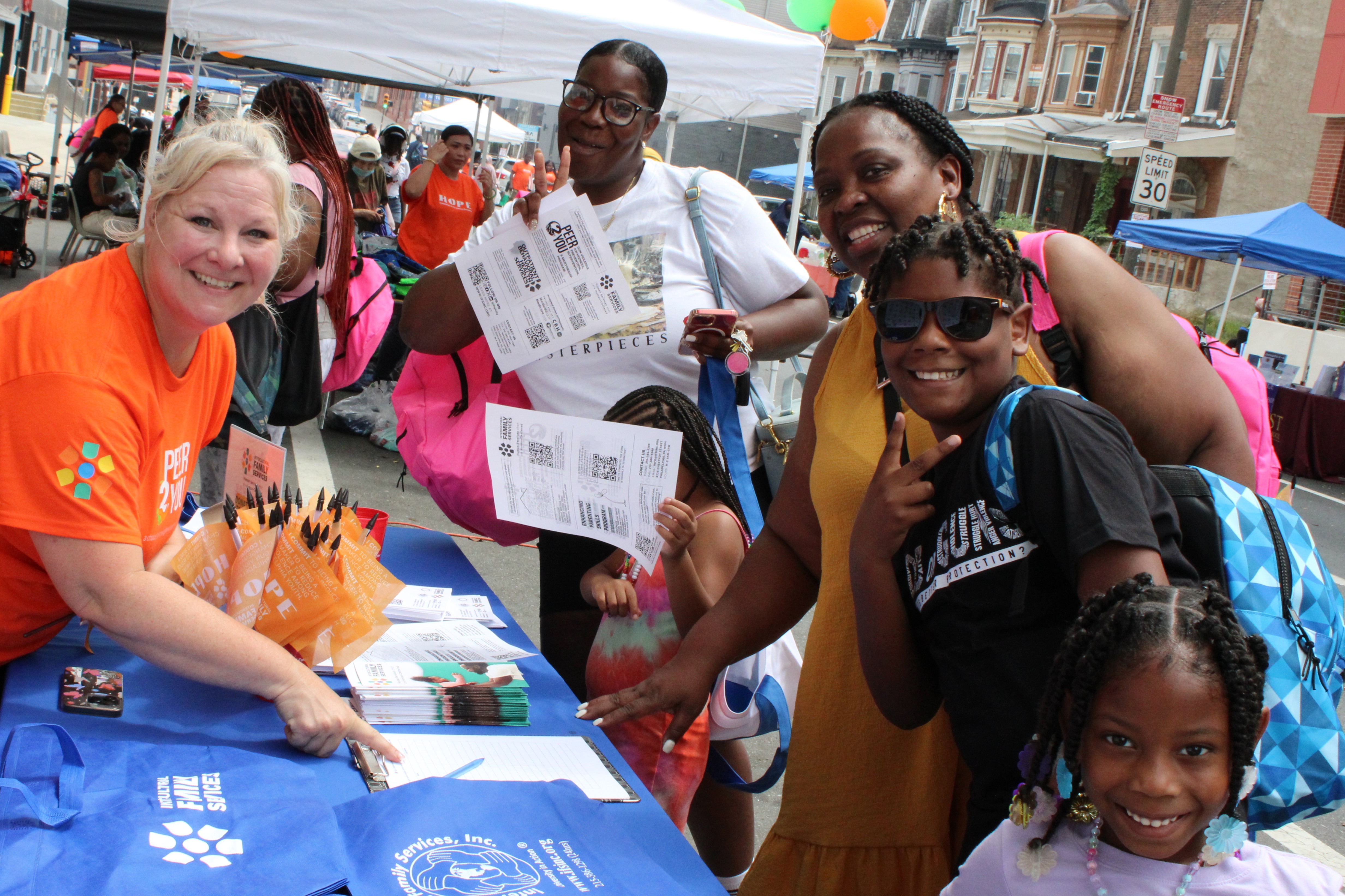 Coeli Baker, Director of Development with Community Members
