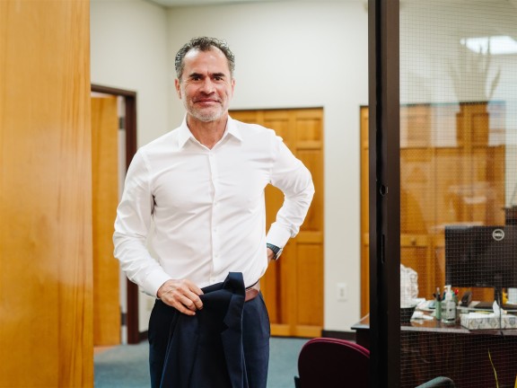 Photo of CEO, Javi Alvarado standing in the IFS office
