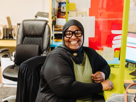 Photo of IFS Employee Diesha F. at her desk in the QA department