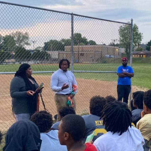 Mentors at football practice